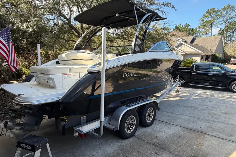 Slide: The Image of 2017 Cobalt R3 boat on trailer in driveway with American flag. - 4