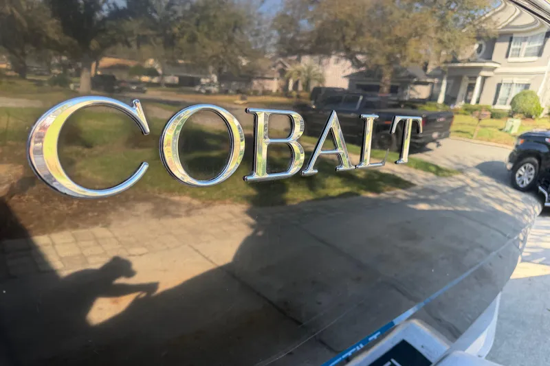 Slide: The Image of 2017 Cobalt R3 boat with chrome logo, parked in residential area. - 6