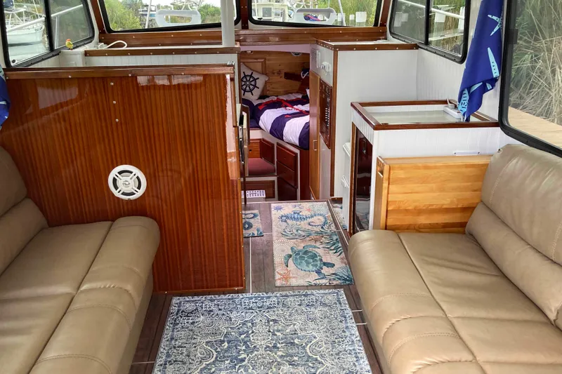 Slide: The Image of Interior of 1978 Prairie Boat Works 29 Coastal Cruiser with cushioned seating. - 11