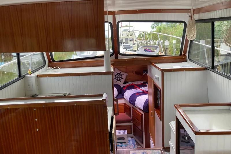 Slide: The Image of Interior of 1978 Prairie Boat Works 29 Coastal Cruiser with cozy seating and nautical decor. - 15
