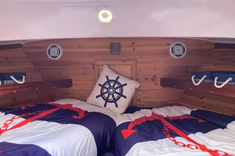 Slide: The Image of 1978 Prairie Boat Works 29 Coastal Cruiser kitchen with stove, sink, and cutting boards. - 20