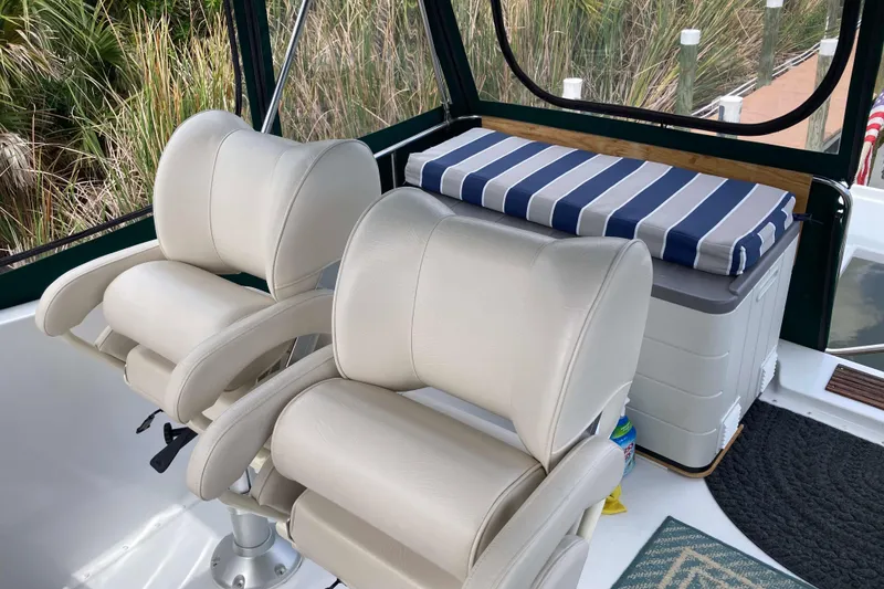 Slide: The Image of 1978 Prairie Boat Works 29 Coastal Cruiser with bicycles on deck, docked by reeds. - 7