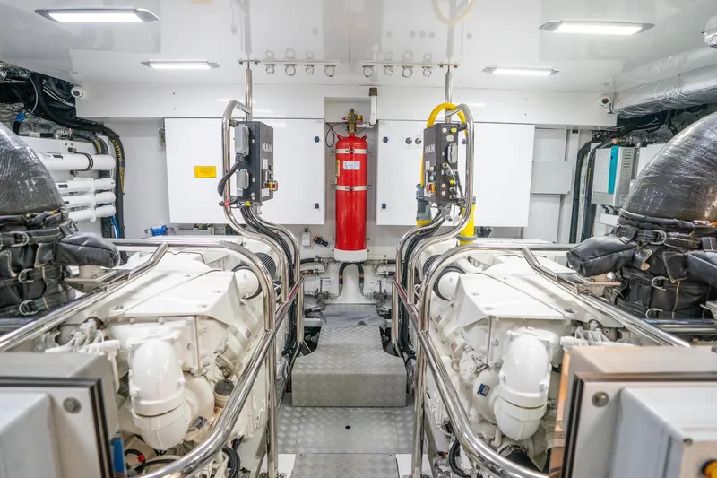 Slide: The Image of Engine room of 2021 Princess Y85 yacht, featuring dual engines and modern equipment. - 30