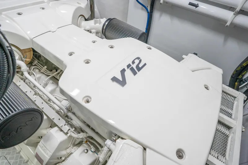 Slide: The Image of Engine room of 2021 Princess Y85 yacht featuring a V12 engine. - 34