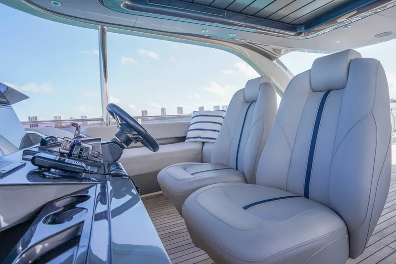 Slide: The Image of Luxurious interior of 2021 Princess Y85 yacht with plush seating and modern controls. - 7