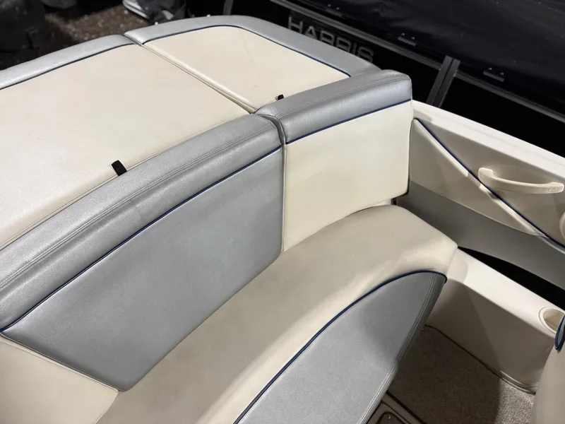 Slide: The Image of Interior of a 2009 Sea Ray 175 boat with gray and white seating. - 12