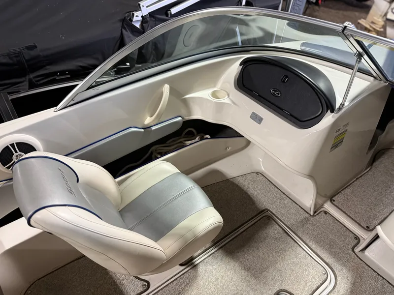 Slide: The Image of Interior of a 2009 Sea Ray 175 boat with seat and dashboard. - 13