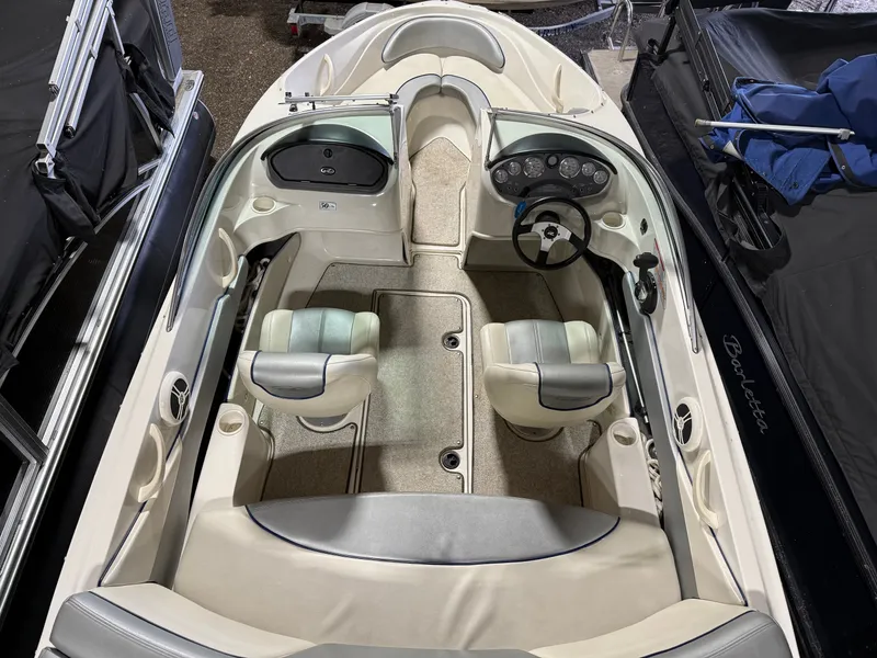 Slide: The Image of Interior of a 2009 Sea Ray 175 boat, beige and gray. - 4