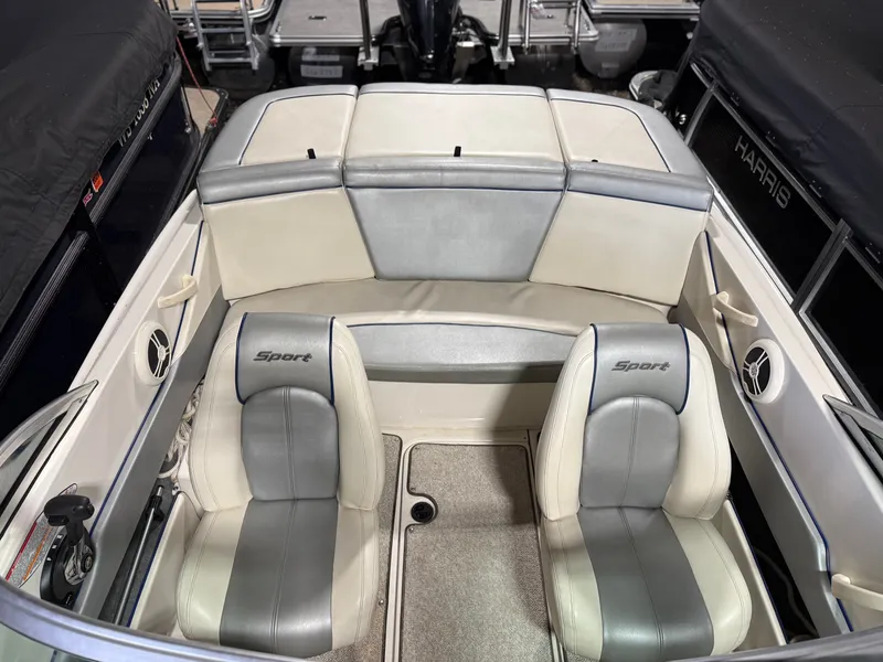 Slide: The Image of Interior of a 2009 Sea Ray 175 sport boat with gray seats. - 6