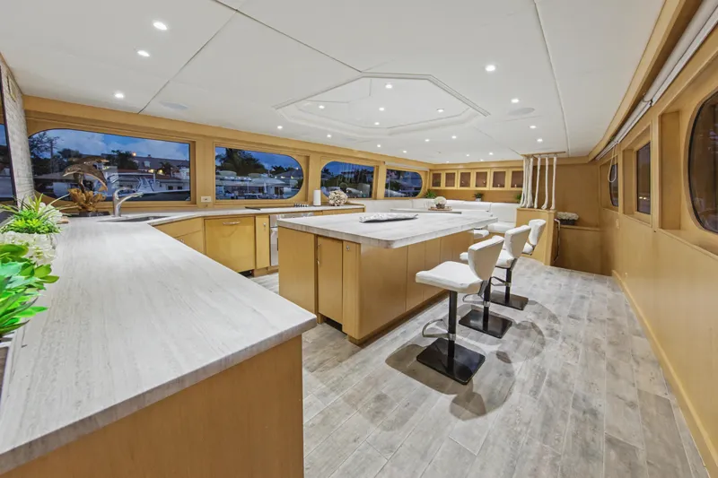 Slide: The Image of Luxurious interior of 2002 Ocean Alexander 120 Megayacht with modern kitchen and elegant seating. - 18