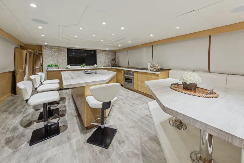 Slide: The Image of Luxurious interior of 2002 Ocean Alexander 120 Megayacht with modern kitchen and seating area. - 19