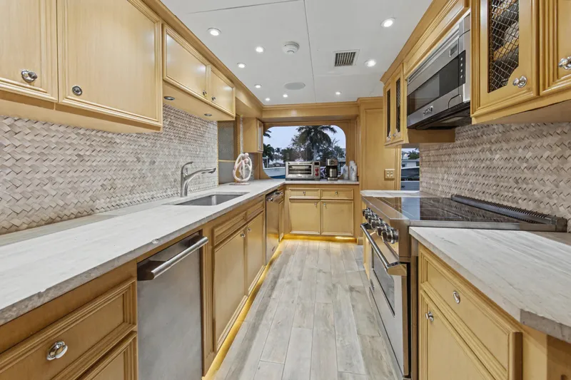 Slide: The Image of Luxurious kitchen interior of 2002 Ocean Alexander 120 Megayacht with modern appliances. - 24