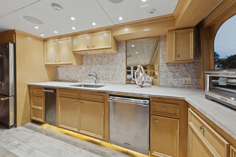 Slide: The Image of Luxury kitchen on 2002 Ocean Alexander 120 Megayacht with Viking appliances and wooden cabinetry. - 25