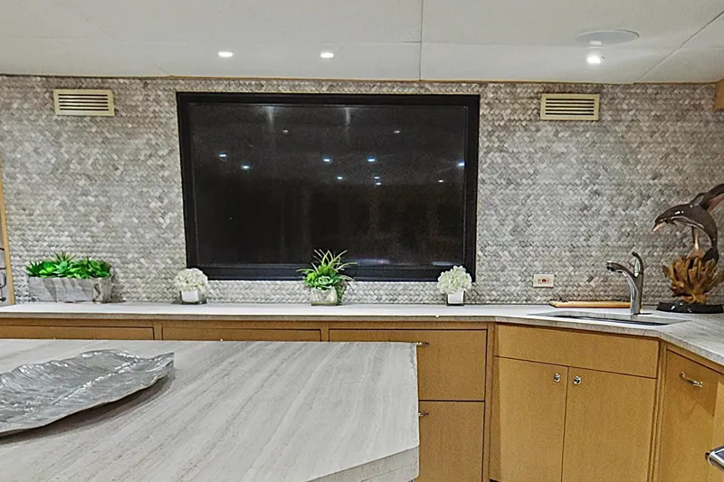 Slide: The Image of Luxurious interior of 2002 Ocean Alexander 120 Megayacht with modern dining area and kitchen. - 31