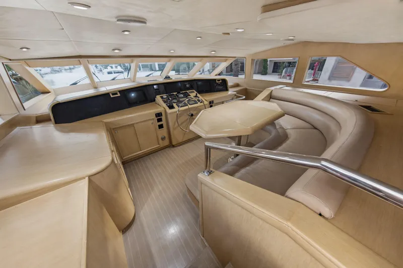 Slide: The Image of Luxurious helm of 2002 Ocean Alexander 120 Megayacht with modern controls and seating area. - 33