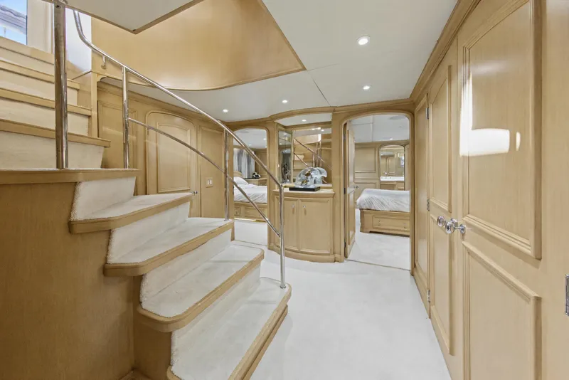 Slide: The Image of Luxurious interior of 2002 Ocean Alexander 120 Megayacht with elegant bedrooms and wooden decor. - 36