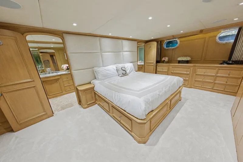 Slide: The Image of Luxurious bedroom interior of 2002 Ocean Alexander 120 Megayacht with elegant wood furnishings. - 38