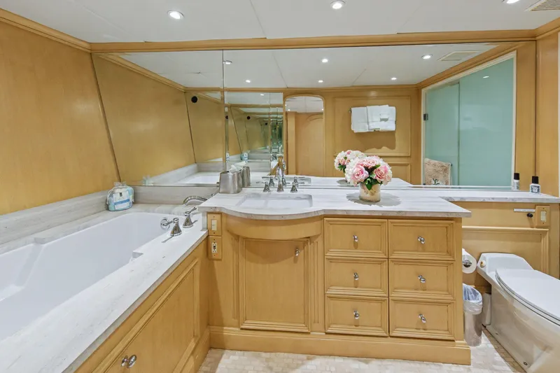 Slide: The Image of Luxurious bathroom on 2002 Ocean Alexander 120 Megayacht with elegant fixtures and wood cabinetry. - 42