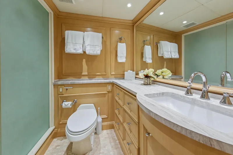 Slide: The Image of Luxurious bedroom on 2002 Ocean Alexander 120 Megayacht with elegant wood paneling. - 43