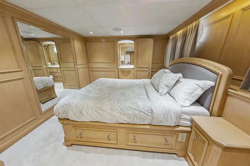 Slide: The Image of Luxurious bathroom on 2002 Ocean Alexander 120 Megayacht with wood cabinetry and glass shower. - 46