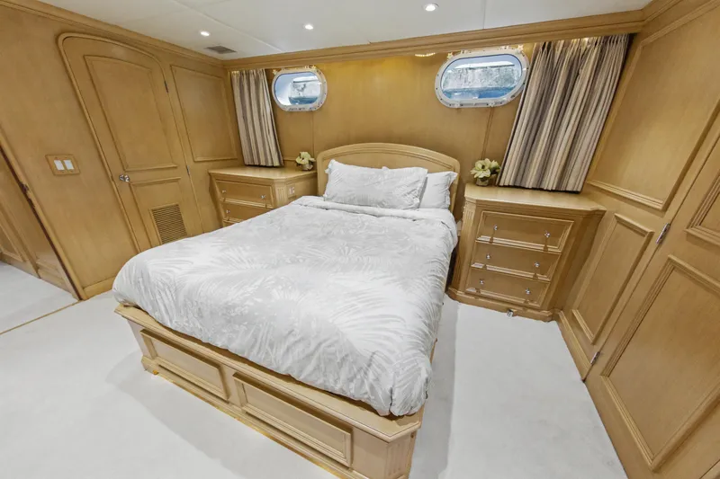 Slide: The Image of Luxurious bathroom on 2002 Ocean Alexander 120 Megayacht with elegant wood cabinetry and modern fixtures. - 49