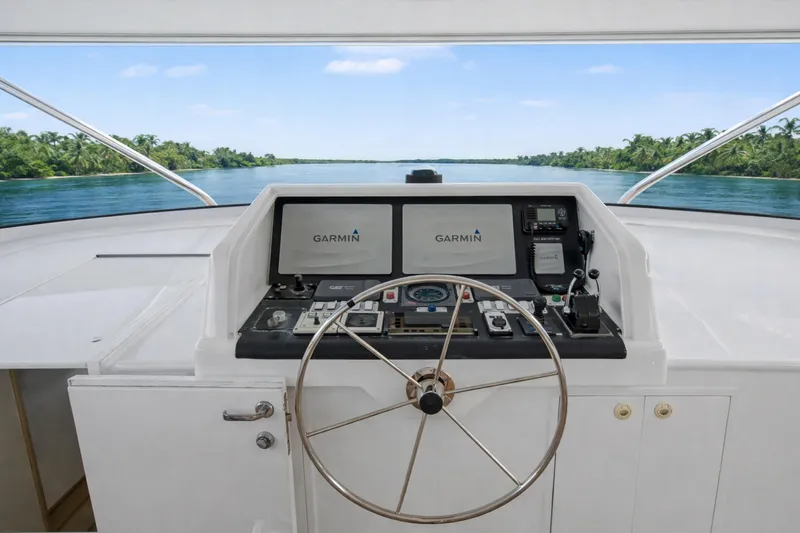 Slide: The Image of Luxurious Ocean Alexander 120 Megayacht deck with elegant seating, ocean view, 2002 model. - 55