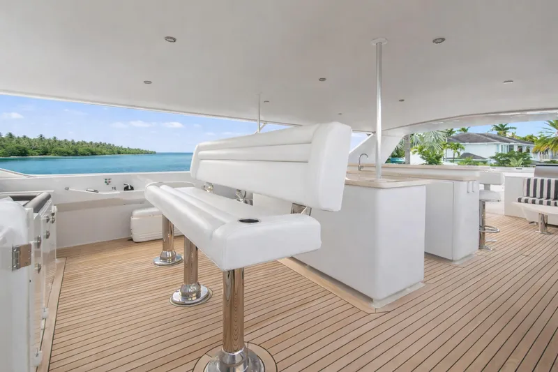 Slide: The Image of Luxurious Ocean Alexander 120 Megayacht deck with bar and seating, 2002 model. - 57
