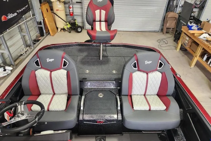 Slide: The Image of 2026 Ranger Z520R Cup-Equipped boat interior with red and gray seating. - 12