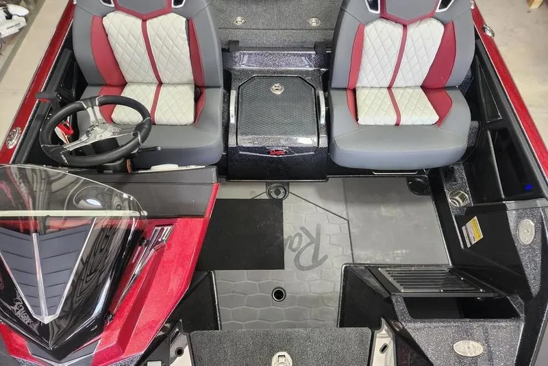 Slide: The Image of 2026 Ranger Z520R Cup-Equipped boat interior with red and gray seating. - 13
