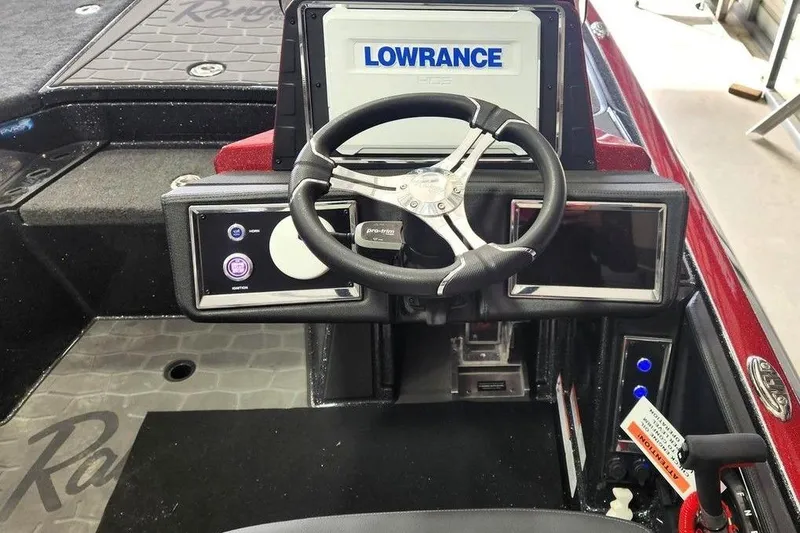 Slide: The Image of 2026 Ranger Z520R Cup-Equipped boat dashboard with steering wheel and Lowrance display. - 3