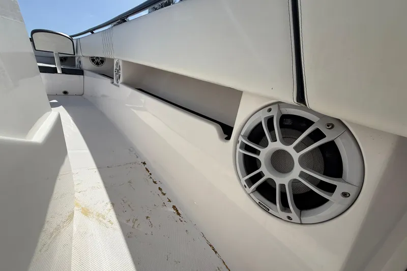 Slide: The Image of Interior of 2020 Streamline 45 boat featuring built-in speakers and sleek white design. - 107