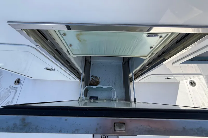 Slide: The Image of Open storage compartment on 2020 Streamline 45 boat deck. - 113