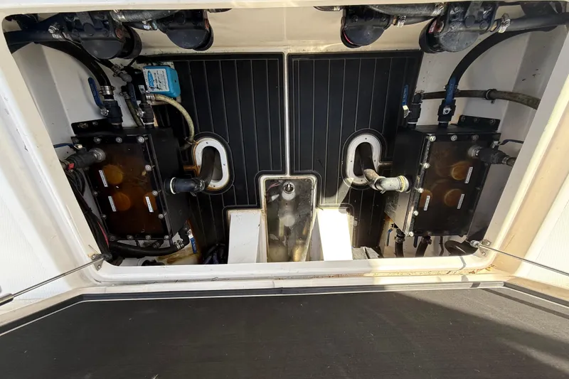 Slide: The Image of Engine compartment of a 2020 Streamline 45 boat, showcasing mechanical components and wiring. - 134