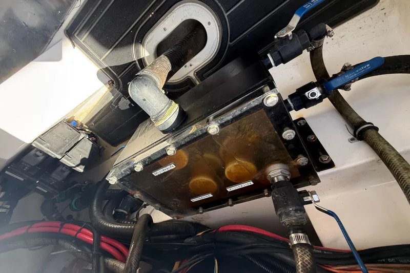 Slide: The Image of Engine compartment of a 2020 Streamline 45 with visible hoses and components. - 135