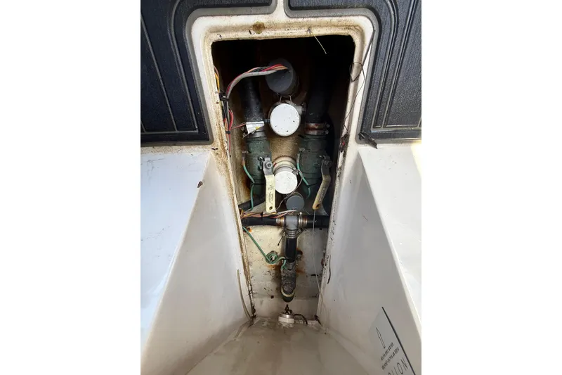 Slide: The Image of Engine compartment of a 2020 Streamline 45 boat, showing mechanical components and wiring. - 138