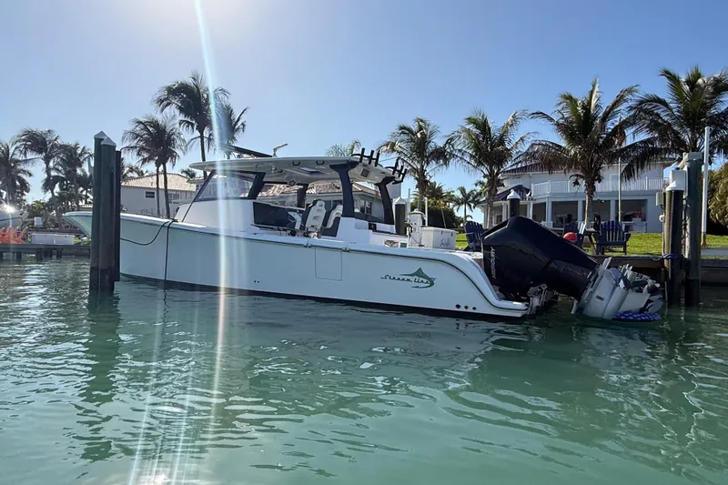 Slide: The Image of 2020 Streamline 45 boat docked in sunny marina with palm trees. - 14