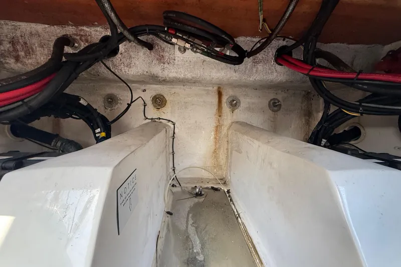 Slide: The Image of Interior view of a 2020 Streamline 45 boat engine compartment with visible wiring. - 140