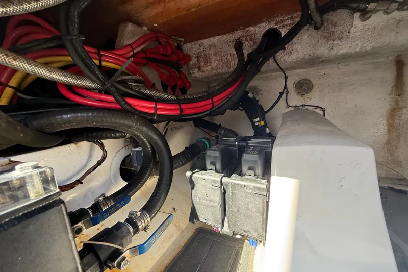Slide: The Image of Electrical wiring and components inside a 2020 Streamline 45 boat, showcasing cables and connectors. - 141