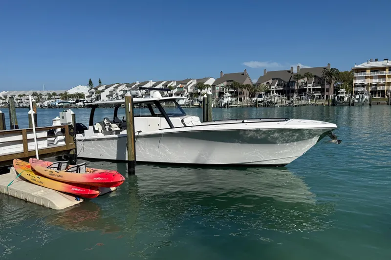 Slide: The Image of Streamline 45 boat docked in marina with kayaks, 2020 model. - 15