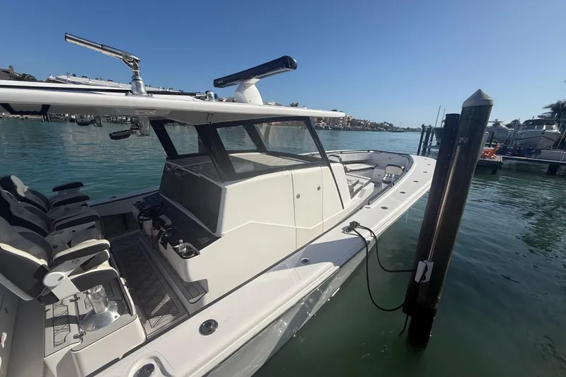 Slide: The Image of 2020 Streamline 45 boat docked in a sunny marina, showcasing sleek design and modern features. - 16