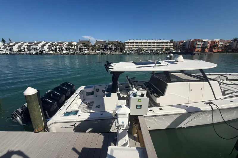 Slide: The Image of Streamline 45 boat docked in marina, 2020 model, with scenic waterfront view. - 19