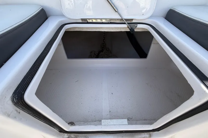 Slide: The Image of Open storage compartment in 2020 Streamline 45 boat, featuring clean interior and secure latch. - 23
