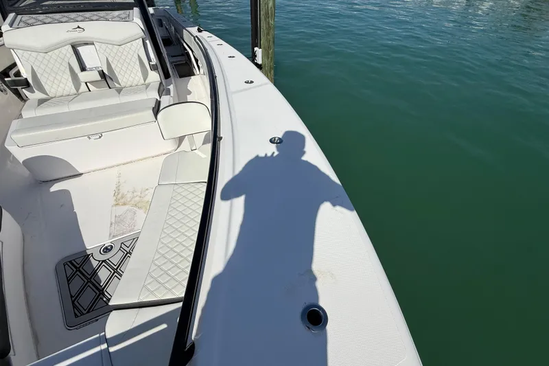 Slide: The Image of Shadow on a 2020 Streamline 45 boat deck by the water. - 28