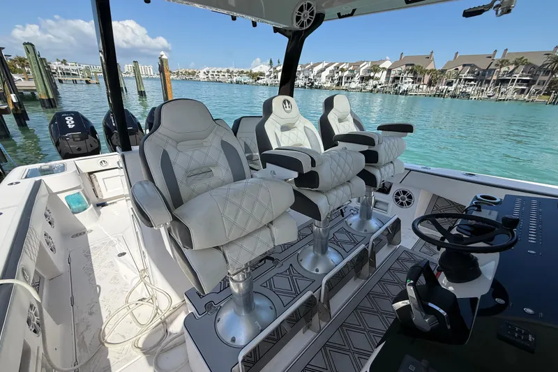 Slide: The Image of Luxury seating on a 2020 Streamline 45 boat, docked by waterfront homes. - 3