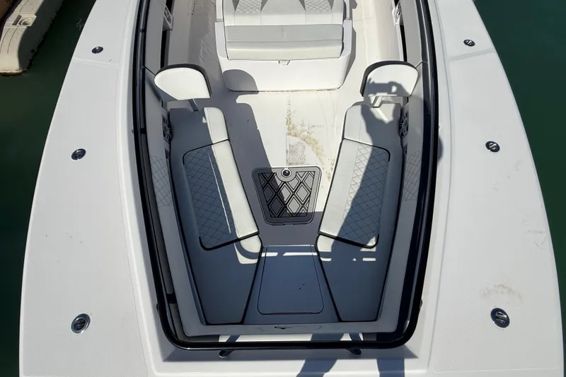 Slide: The Image of Front deck of 2020 Streamline 45 boat with seating and storage compartments. - 30