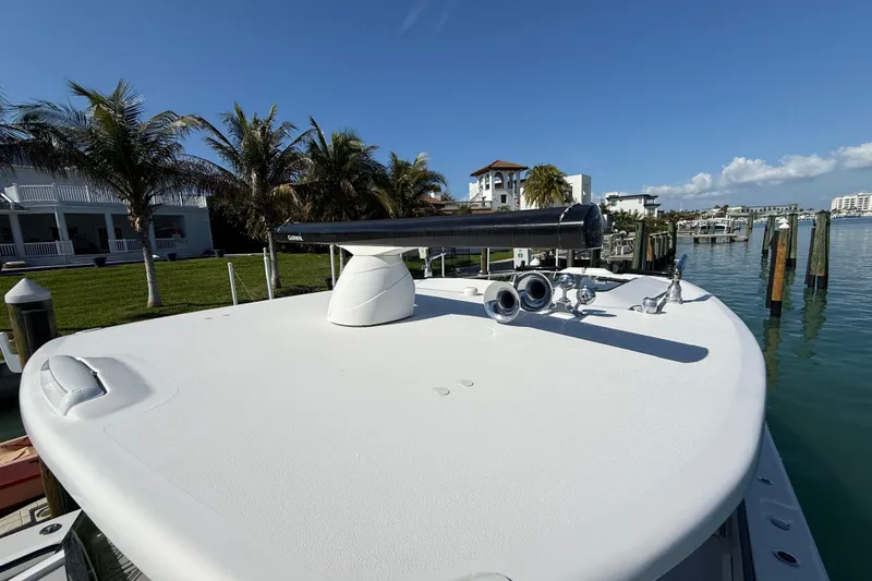 Slide: The Image of 2020 Streamline 45 boat docked by palm trees and waterfront homes. - 32