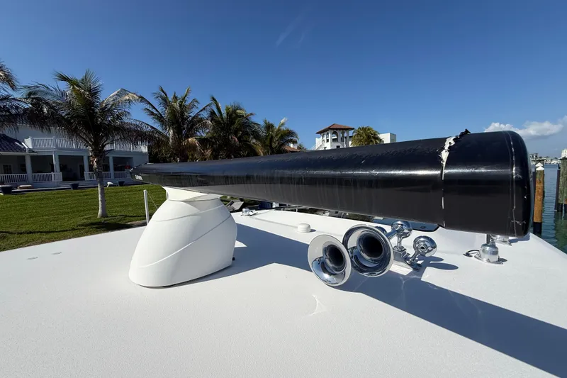Slide: The Image of Rooftop view of a 2020 Streamline 45 boat with palm trees and blue sky. - 33