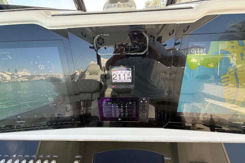 Slide: The Image of Control panel of a 2020 Streamline 45 boat with digital displays and navigation equipment. - 55