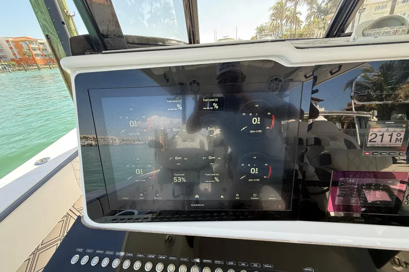 Slide: The Image of Dashboard of a 2020 Streamline 45 boat with digital display and controls. - 58
