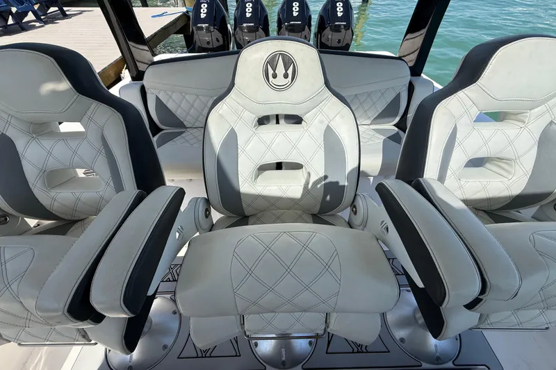 Slide: The Image of Luxury boat seating with diamond stitching, Streamline 45 model, 2020, docked by the water. - 62